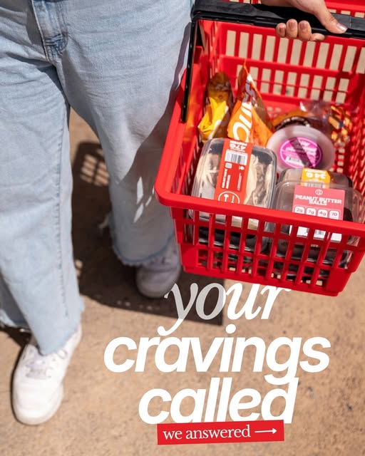A red basket of Fork to Fit meals and snacks with the words Your cravings called, we answered.